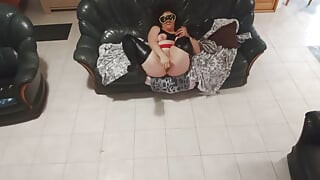 In black latex with black dildo