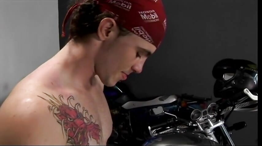 Black chick gives biker head in the garage