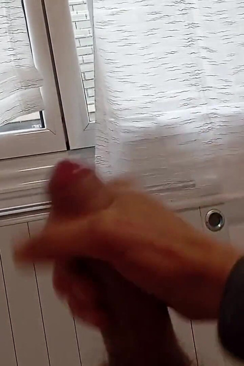 The Guy Jerks off His Monster in Front of the Window Watching the Neighbors Who Might See Him