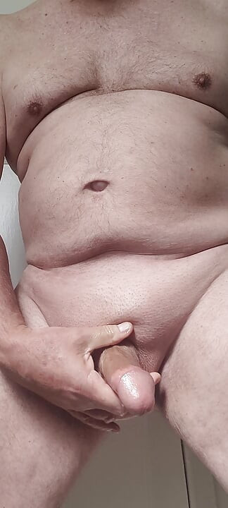 Solosexual strokes my shaved, oiled up cock to get a load of cum to swallow