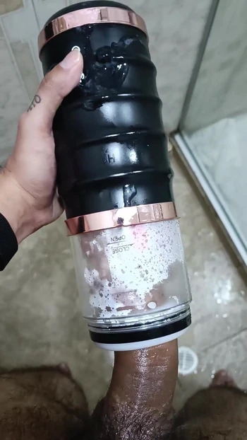 Powerful moment from "POV Big Uncut Cock Camilo Brown Using An Automatic Masturbation Toy To Get An Intense Cumshot Orgasm"