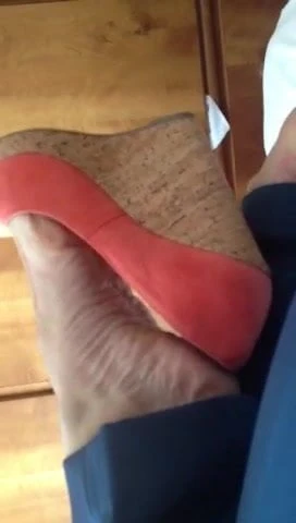 Orange wedges heels teasin' up bed