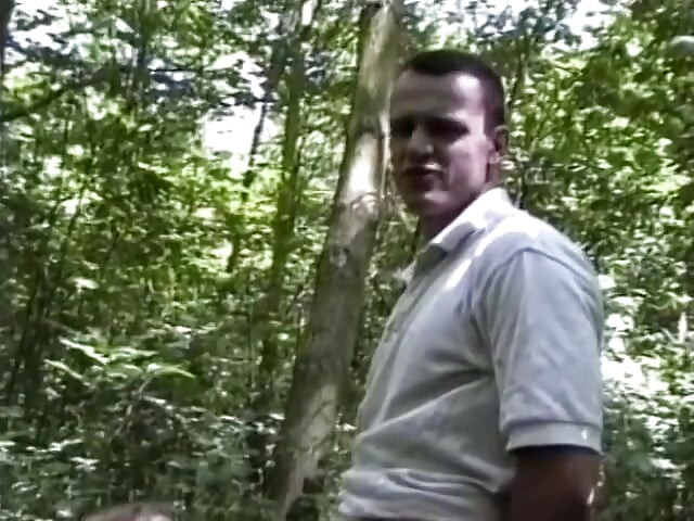 Busty brunette teen blowing big dick in the forest