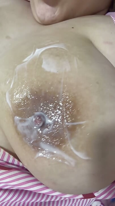 Mom plays with her cream on her delicious huge tits