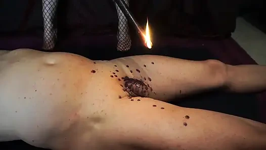 Mistress punishing his cock and body witn a wax