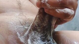 Indian guy is washing his big cock on bathroom