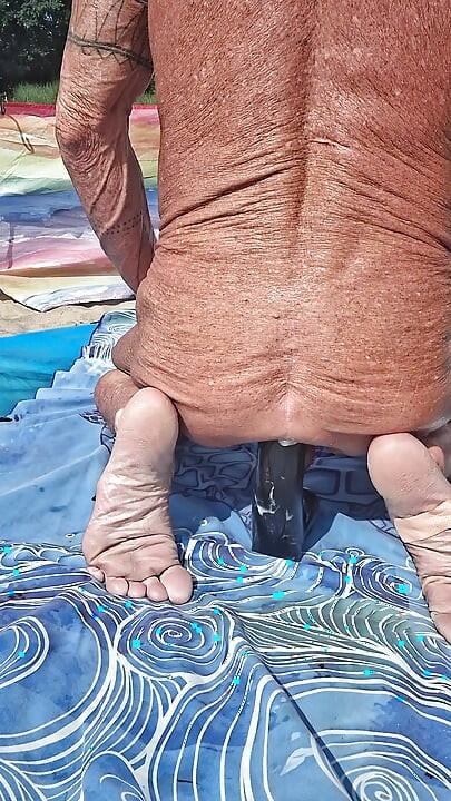 Early morning at the beach stretching of my asshole with my huge black dildo