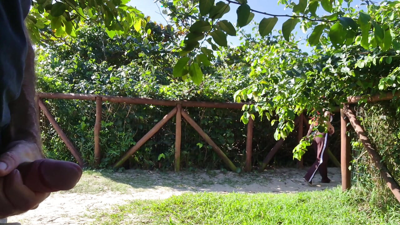 Risky handjob for hot redhead on the walk in the park in public!