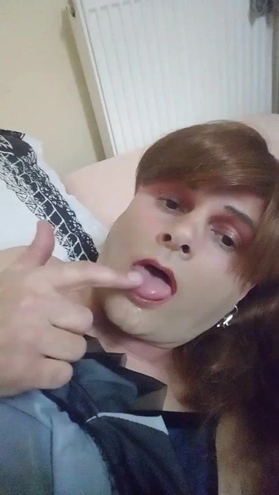 Sissy masturbates in a suit and sperm