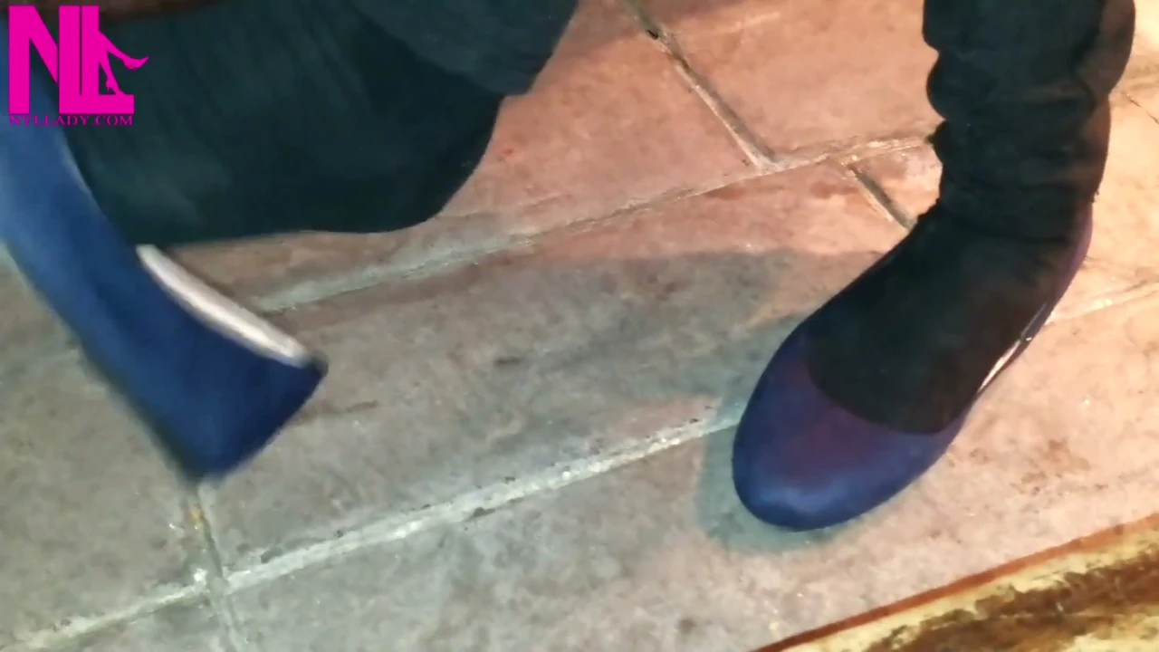 Dangling in Blue Ballet Flats in a Bar