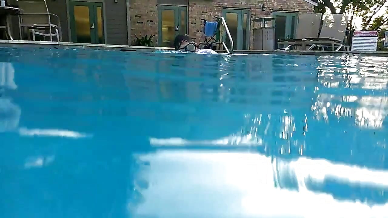 Couple Underwater Diving and Swimming