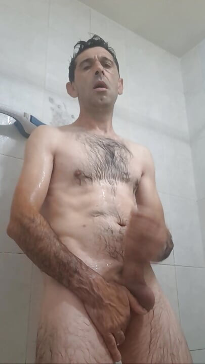 Straight guy with a huge cock jerks off in the shower until he gets all the milk out.