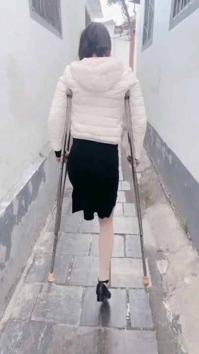 amputee girl on crutches