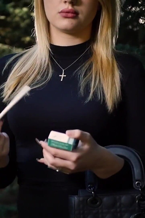 Hot Blonde Babe Smoking One Black Cigarettes in Nature