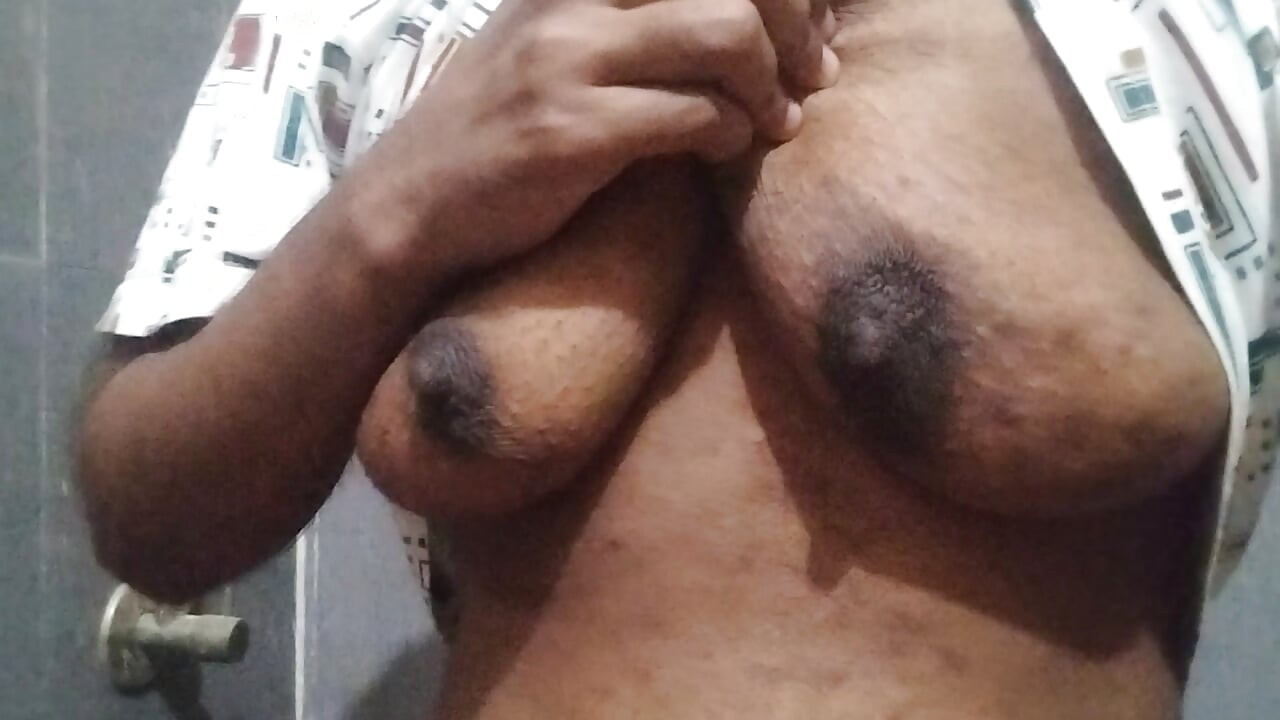Busty Indian babe playing with her boobs and pussy while peeing