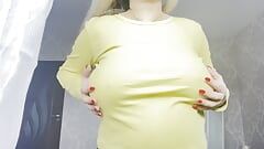 Sexy pregnant blonde teasing with big boobs