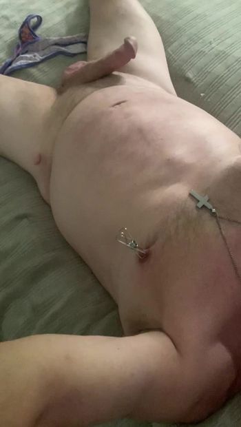 Laying in bed with nipple clamps on, tugging my nipple clamps and stroking my cock with my sissy panties on the bed