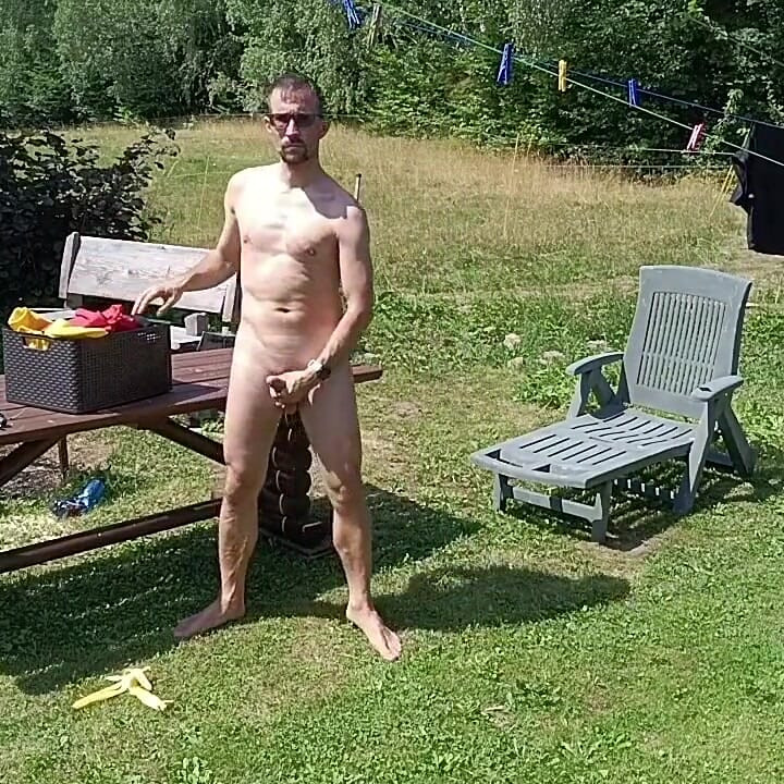 Jerking off While Hanging Out the Laundry