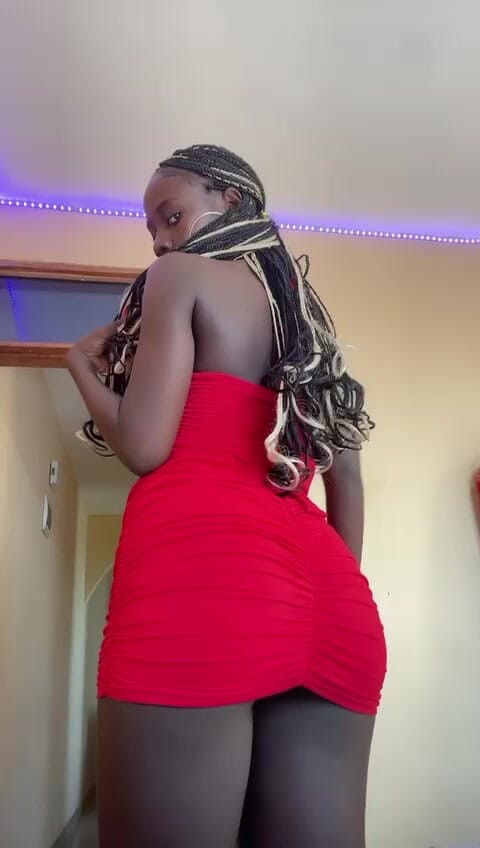 Hot Kenyan woman presents her tight red dress, just for you!