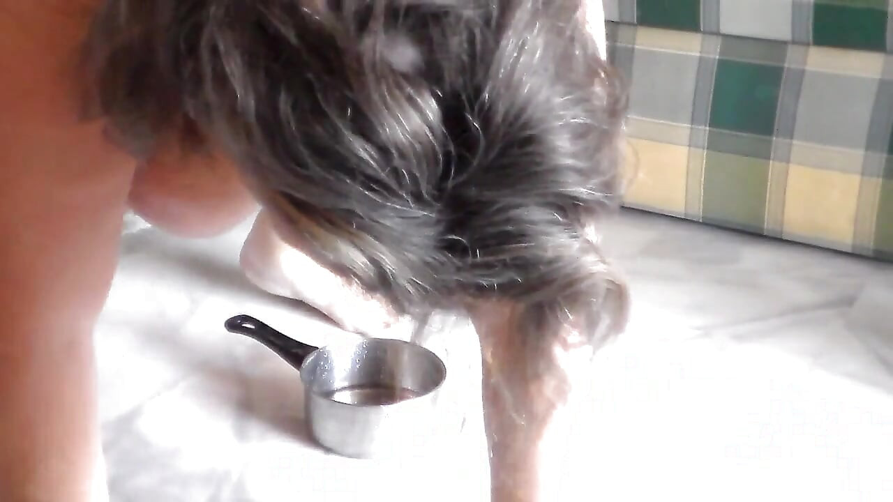 Jen is Peeing all into a small Pot