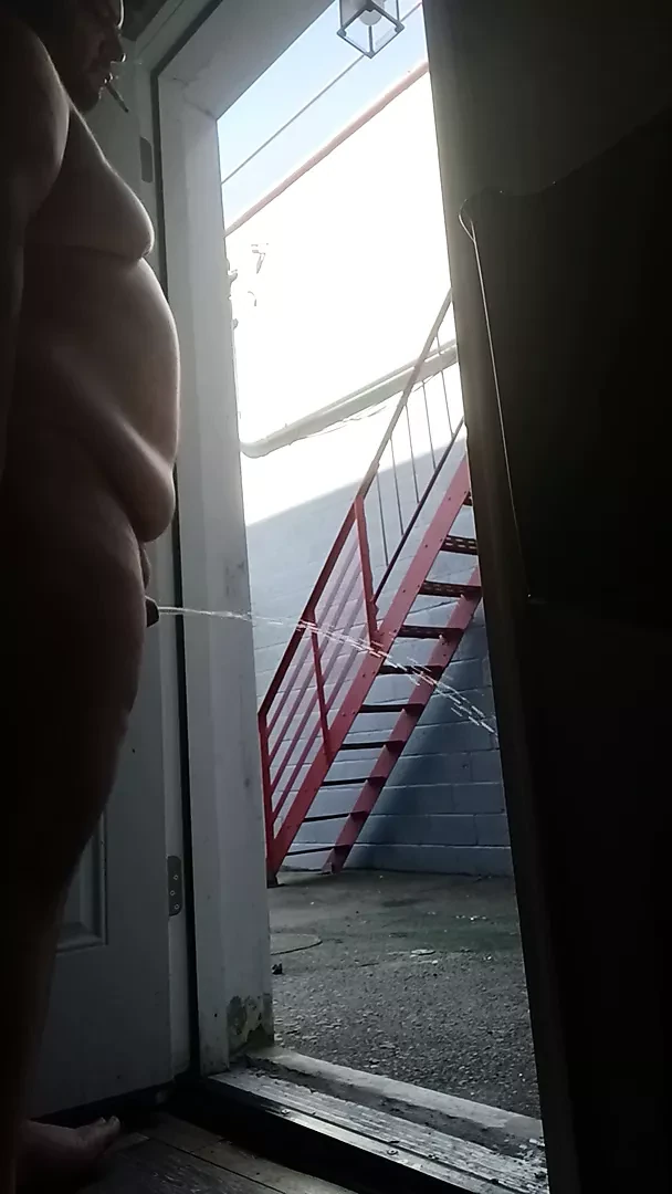 Mofo2121 pissing  out the back door