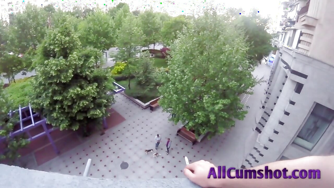 He smokes and relaxes on the balcony while she on her knees suck his dick