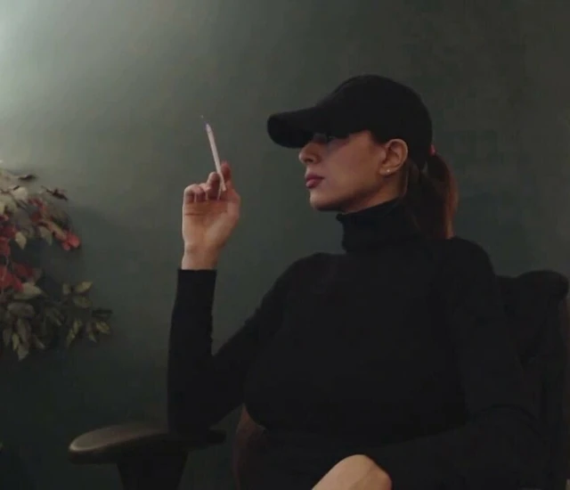 Smoking 120 wearing sweater