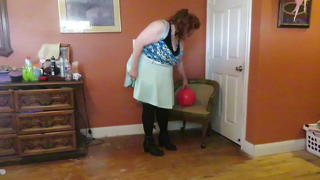 Nurse Vicki  plays with a rubber ball in a mini skirt, sexy stockings and high heel mini boots