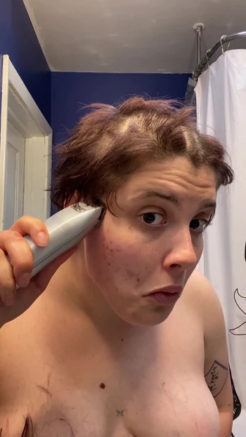 Iconic moment from "Hairless Whore - Adama Daat Amateur Fetish Head and Brow Shave"