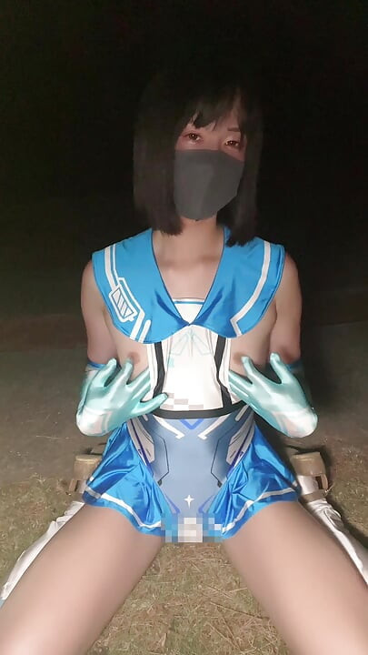 Sailor uniform-style cosplay crossdressing in the park