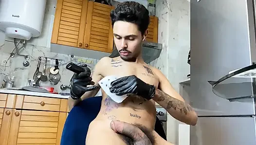 Skinny guy with a big, thick dick getting a tattoo and then jerking off.
