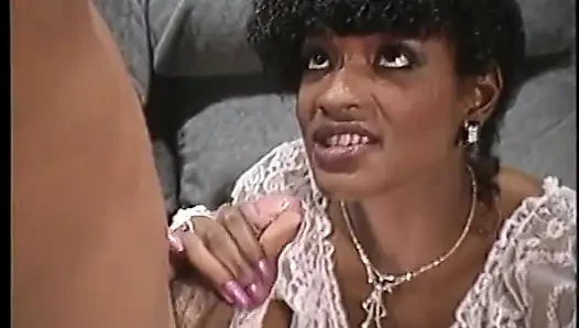 Hot ebony in white lingerie takes cock on a couch