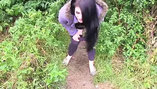Busty brunette gets picked up before pissing outdoors