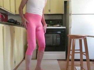 Crossdressing slut in tight leggings.