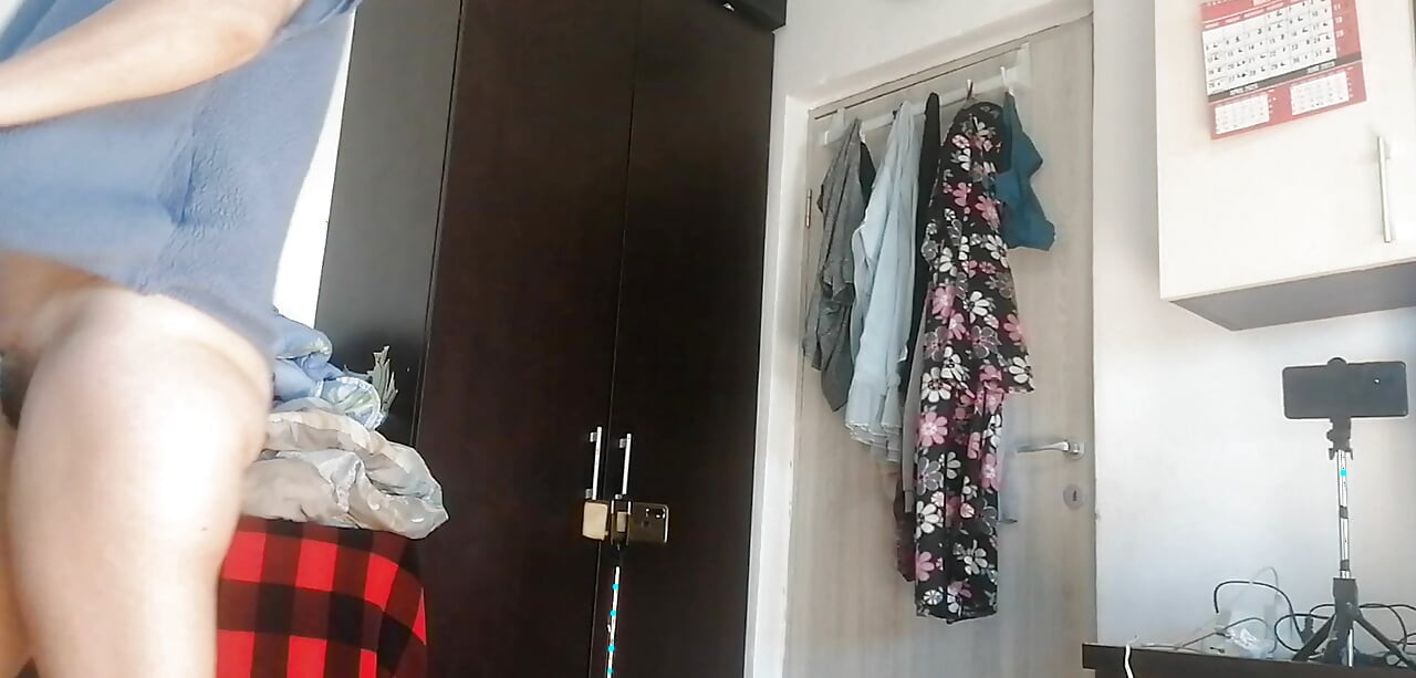 Amateur woman has fun trying on clothes and cutting them. Amateur woman vacuums naked in the house.