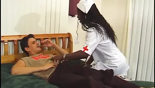 Hot black nurse in stockings gets pounded and creamed by a white dude in bed