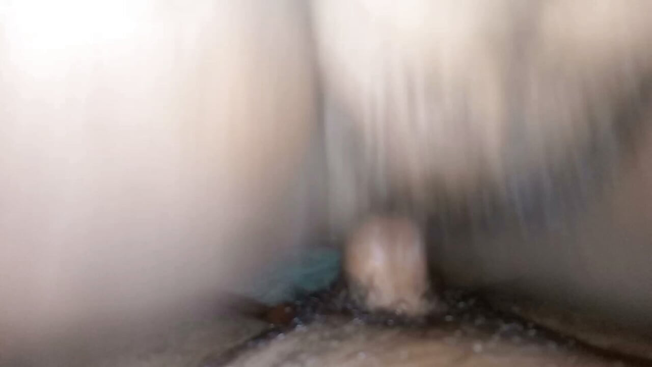 A lustful Indian girl is bathing with her large breasts exposed.