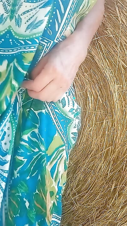 In the countryside: hay bale and red pussy