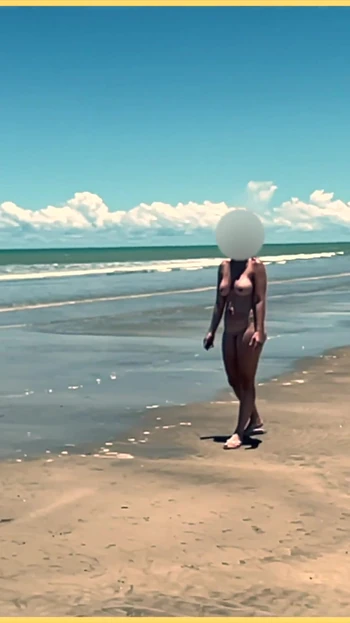 Jaw-dropping moment from "Wifey strips nude and plays with the football at the beach"