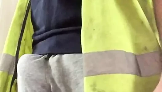 Scally builder's bulge in grey sweatpants and hi vis
