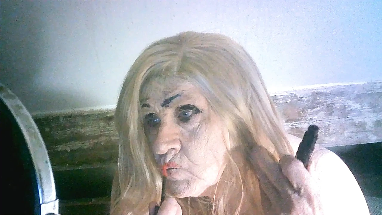 Ugly old sissy spunk bucket slag Sarah tries to make herself attractive to men by applying makeup to her ugly slag face