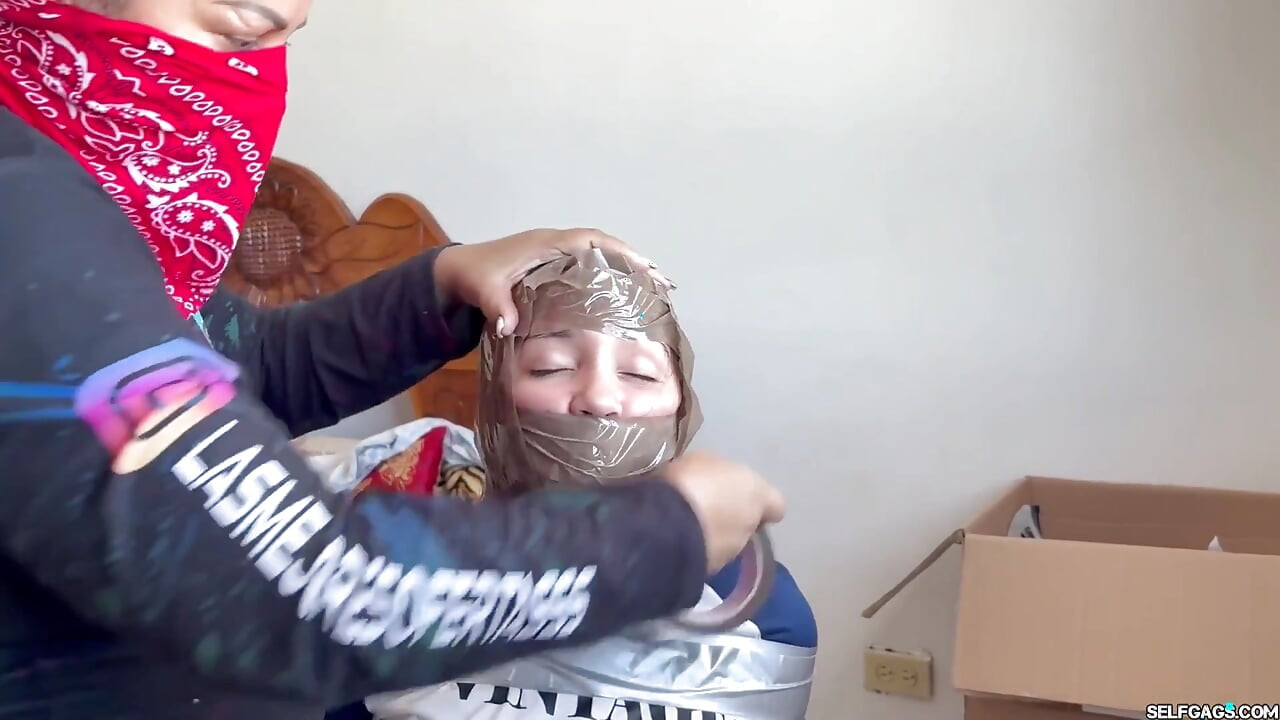 Fantasizing 18-year-old Taped & Gagged by Masked MILF