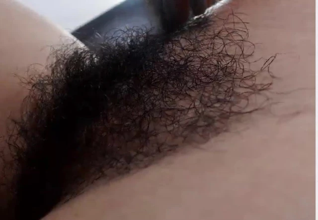 Hairy MILF Runs fingers through her Bush