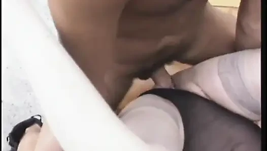 Dirty old blonde gets fucked from behind while sucking cock in gang bang