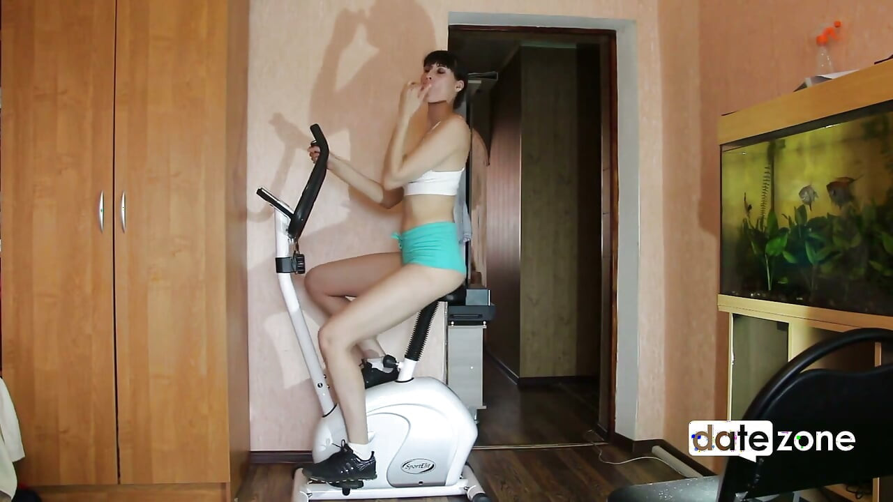 Leggy MILF Rides Exercise Bike with a Fake Cock on the Seat