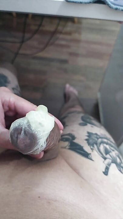 PLAYING WITH A CONDOM FILLED WITH SPERM