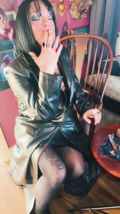 Your Favourite Smoking Queen Dressed In A Full Length Leather Coat, Pantyhose & High Heels Smokes A Cork 100 Cigarette For You