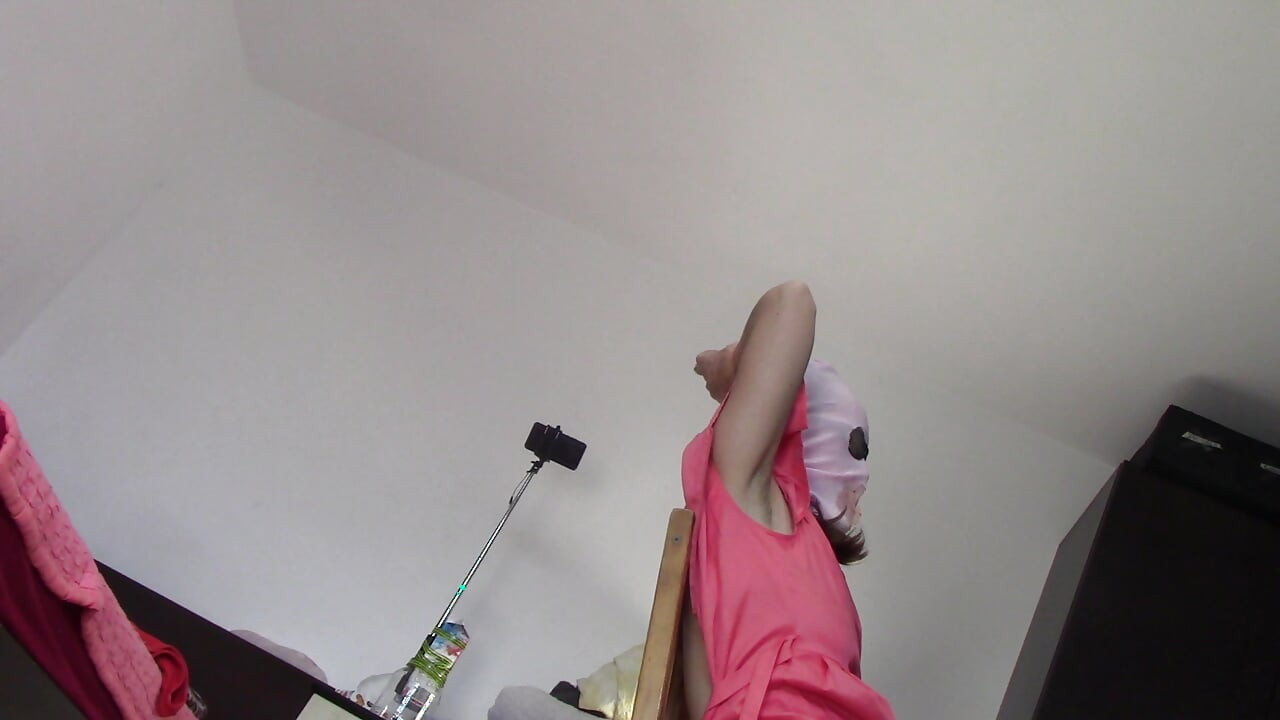 Amateur wife dancing naked at home. Amateur woman has fun trying on clothes and cutting them.