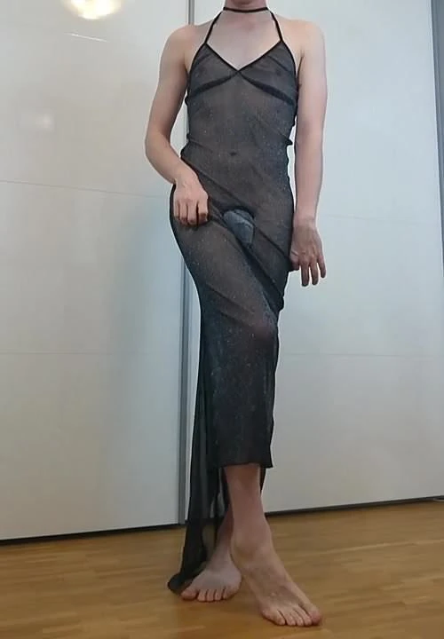 Boy poses barefoot in elegant dress