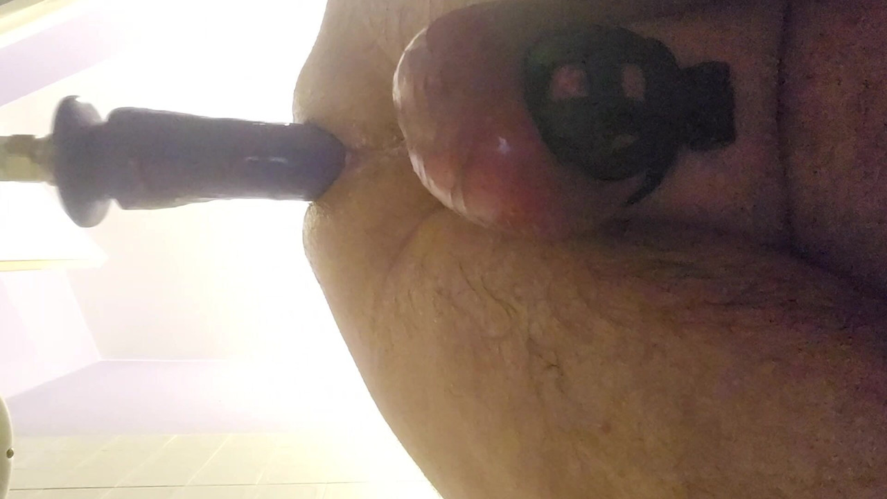 Fucking machine with chastity cage